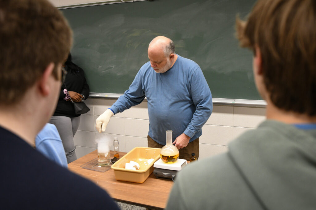 Science professor performs chemistry experiment