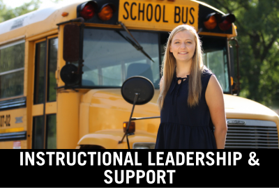 Click here to donate to the department of Instructional Leadership and Support. Image of student posing in front of school bus.