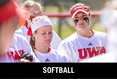 Click here to donate to the UWA Softball Team. Image of softball players in a huddle