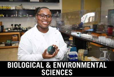 Click here to donate to the Department of Biological and Environmental Sciences. Image of student posing with bacteria culture