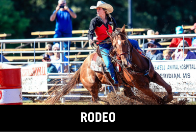 Click here to donate to the UWA Rodeo Team. Image of cowgirl competing in the barrel racing event.