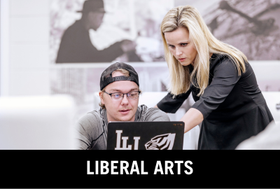 Donate to the College of Liberal Arts. Image of professor assisting student with work on a laptop